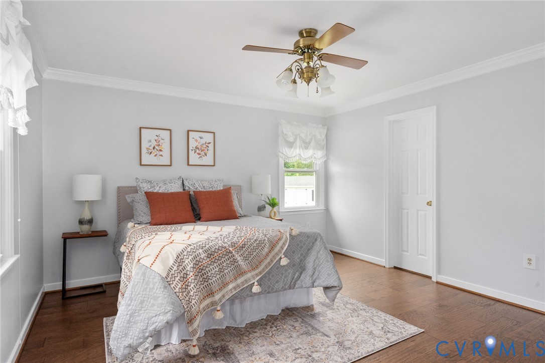 16379 Arch Hill Road Hanover, VA 23069 - Photo 16 of 26 a bedroom with a bed a table and painting on the wall