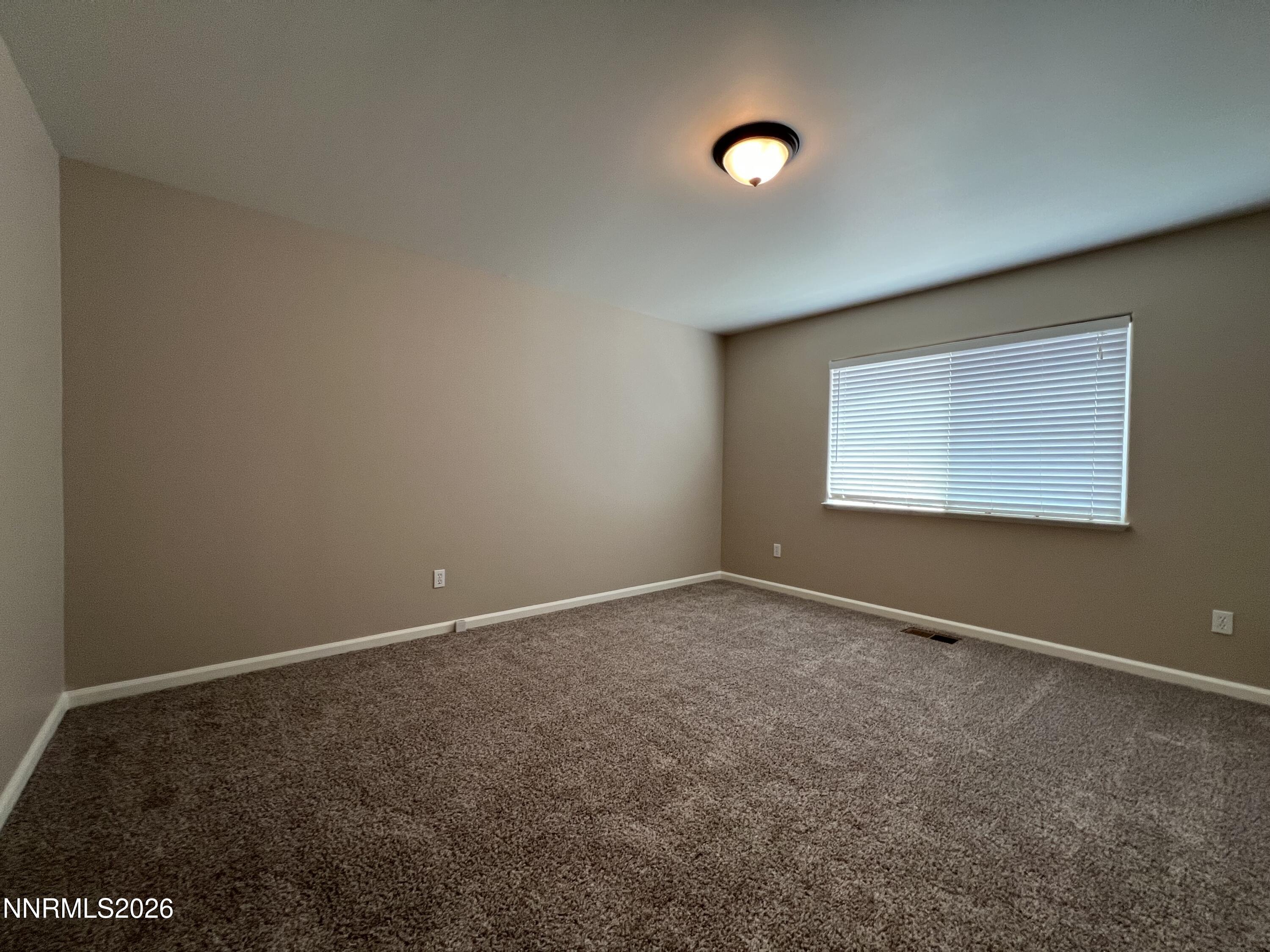 18406 Teddy Bear Court Reno, NV 89508 - Photo 22 of 44 an empty room with a window