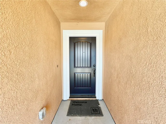 a view of front door with wooden floor