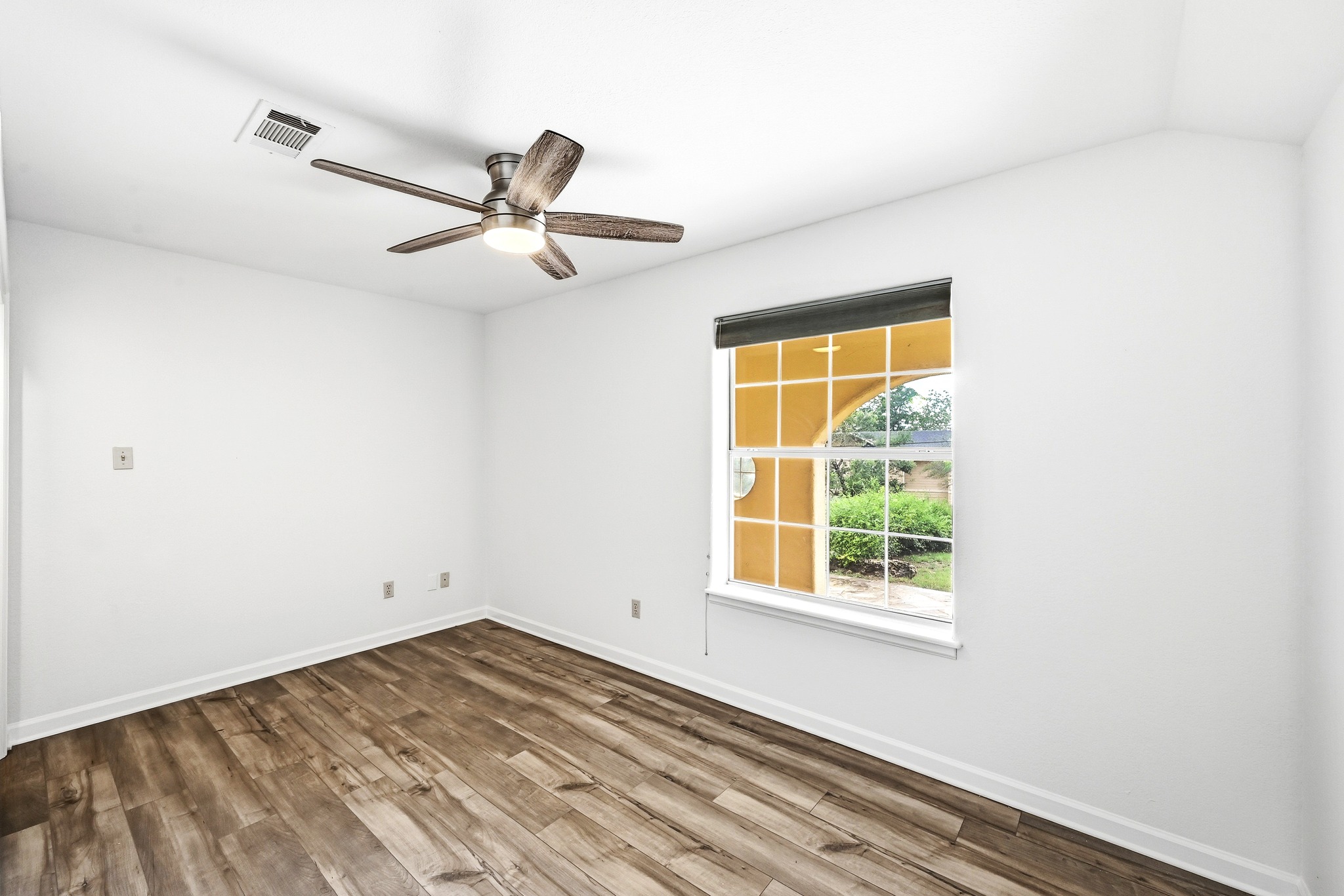 2405 Bahama Road Austin, TX 78733 - Photo 30 of 39 a view of empty room with wooden floor and fan