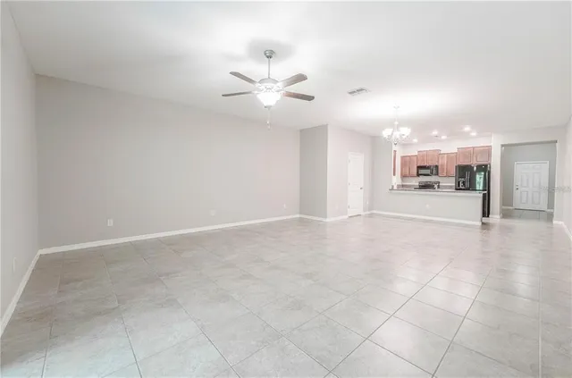 a view of a livingroom with a kitchen