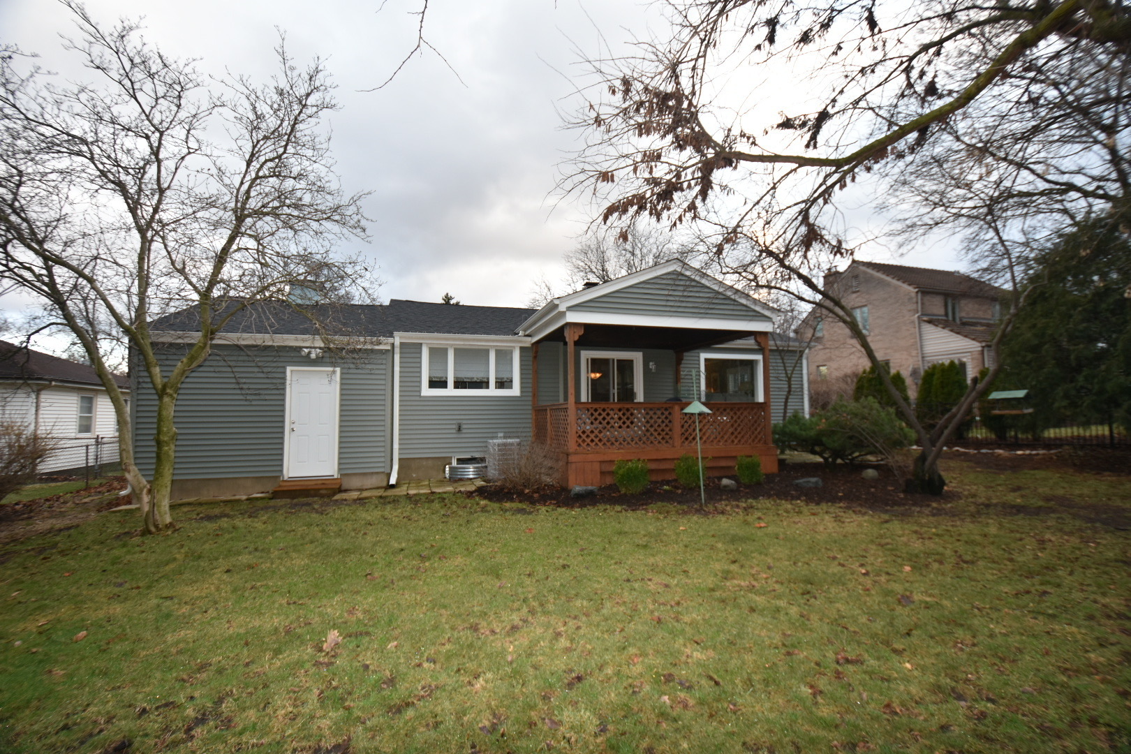 111 West Prairie Avenue Wheaton, IL 60187 - Photo 15 of 24 a front view of a house with a garden