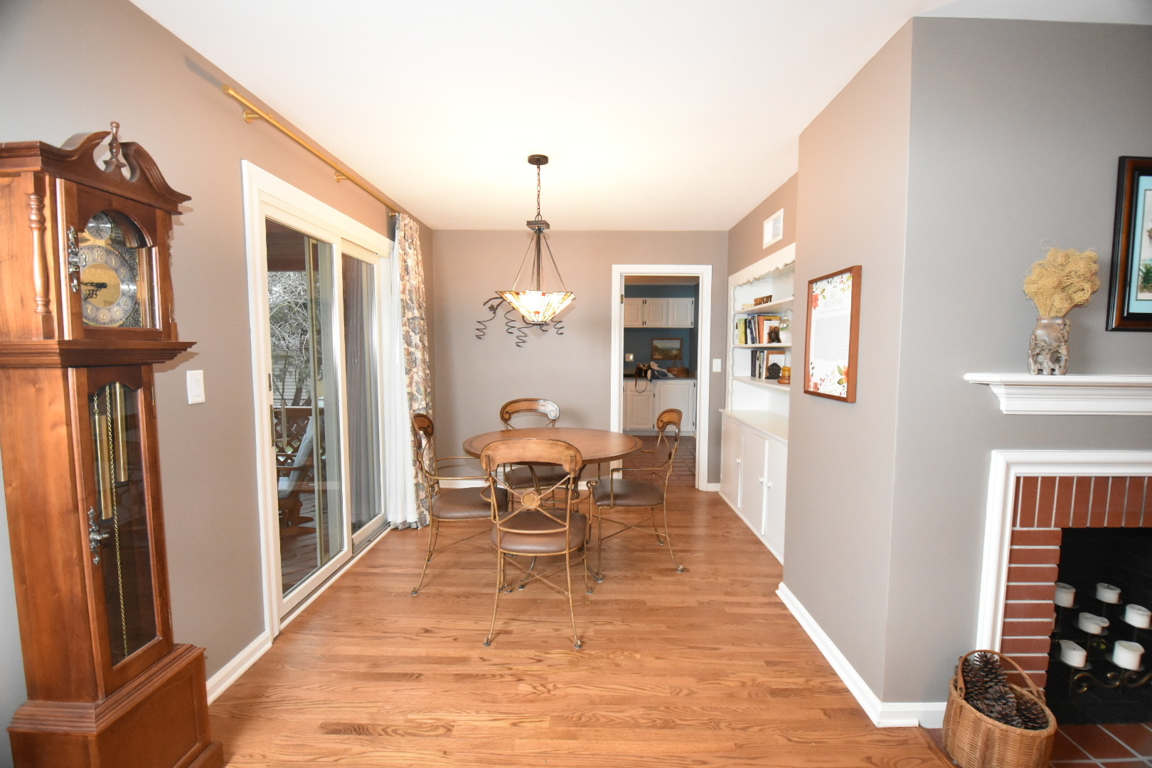 111 West Prairie Avenue Wheaton, IL 60187 - Photo 6 of 24 a dining room with furniture entryway and wooden floor