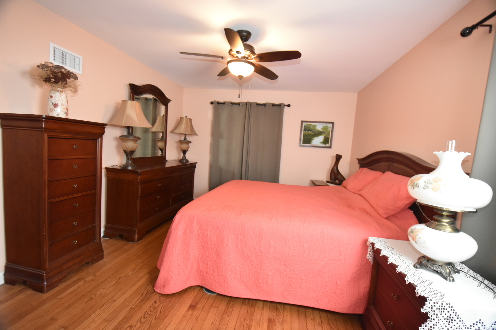 111 West Prairie Avenue Wheaton, IL 60187 - Photo 7 of 24 a bedroom with a bed and wooden floor