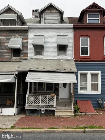a view of a brick building with many windows