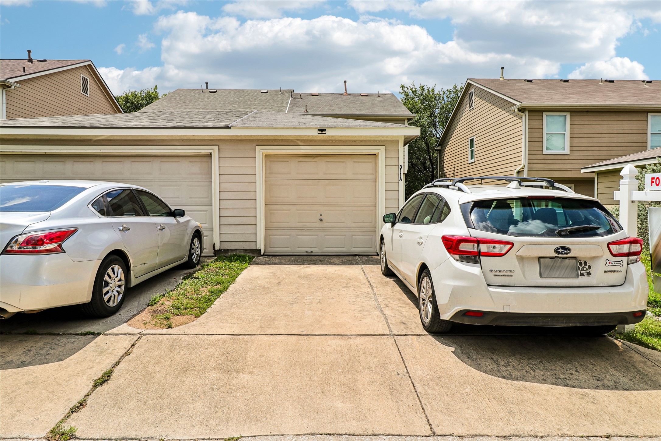 311 A Utterback Kyle, TX 78640 - Photo 33 of 40 a view of a white car parked in front of a house