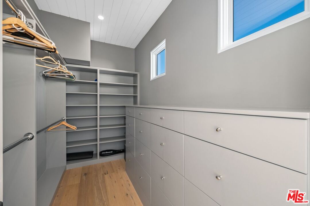 27212 Escondido Beach Road Malibu, CA 90265 - Photo 20 of 35 a view of walk in closet with empty racks