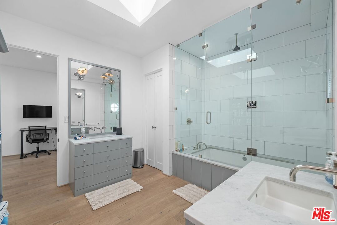 27212 Escondido Beach Road Malibu, CA 90265 - Photo 24 of 35 a spacious bathroom with a tub sink shower and mirror