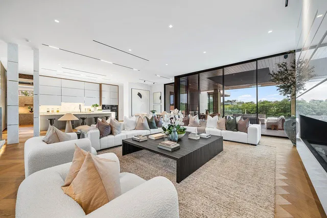 a dining room with furniture and a floor to ceiling window