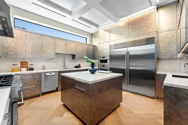 a living room with furniture a dining table and a floor to ceiling window