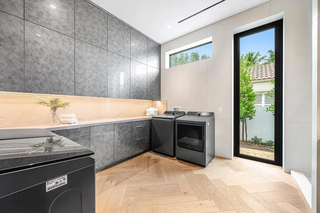 a bedroom with furniture and a large window