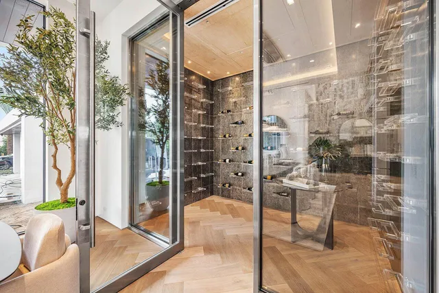 a large tub sitting in a bathroom next to a window