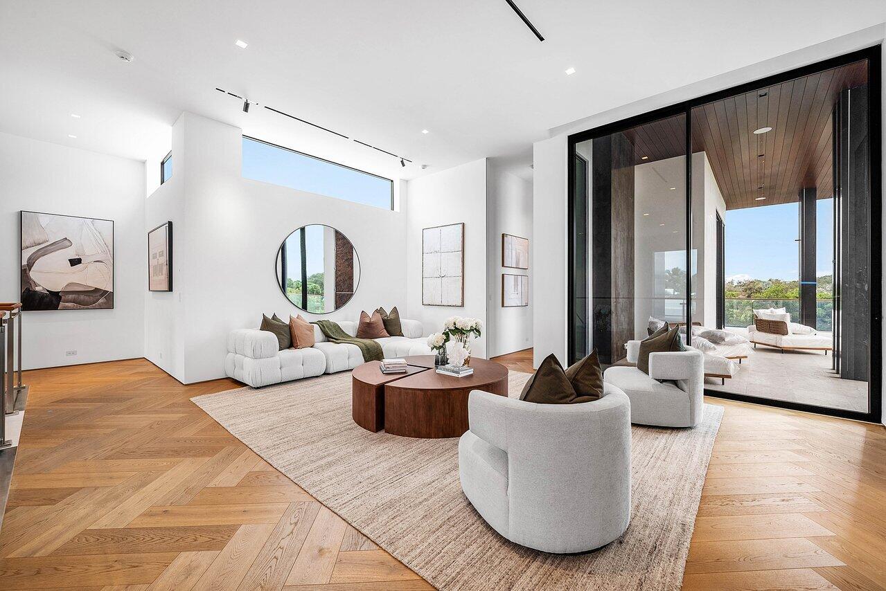 126 Spinnaker Lane Jupiter, FL 33477 - Photo 71 of 96 a living room with furniture and a large window