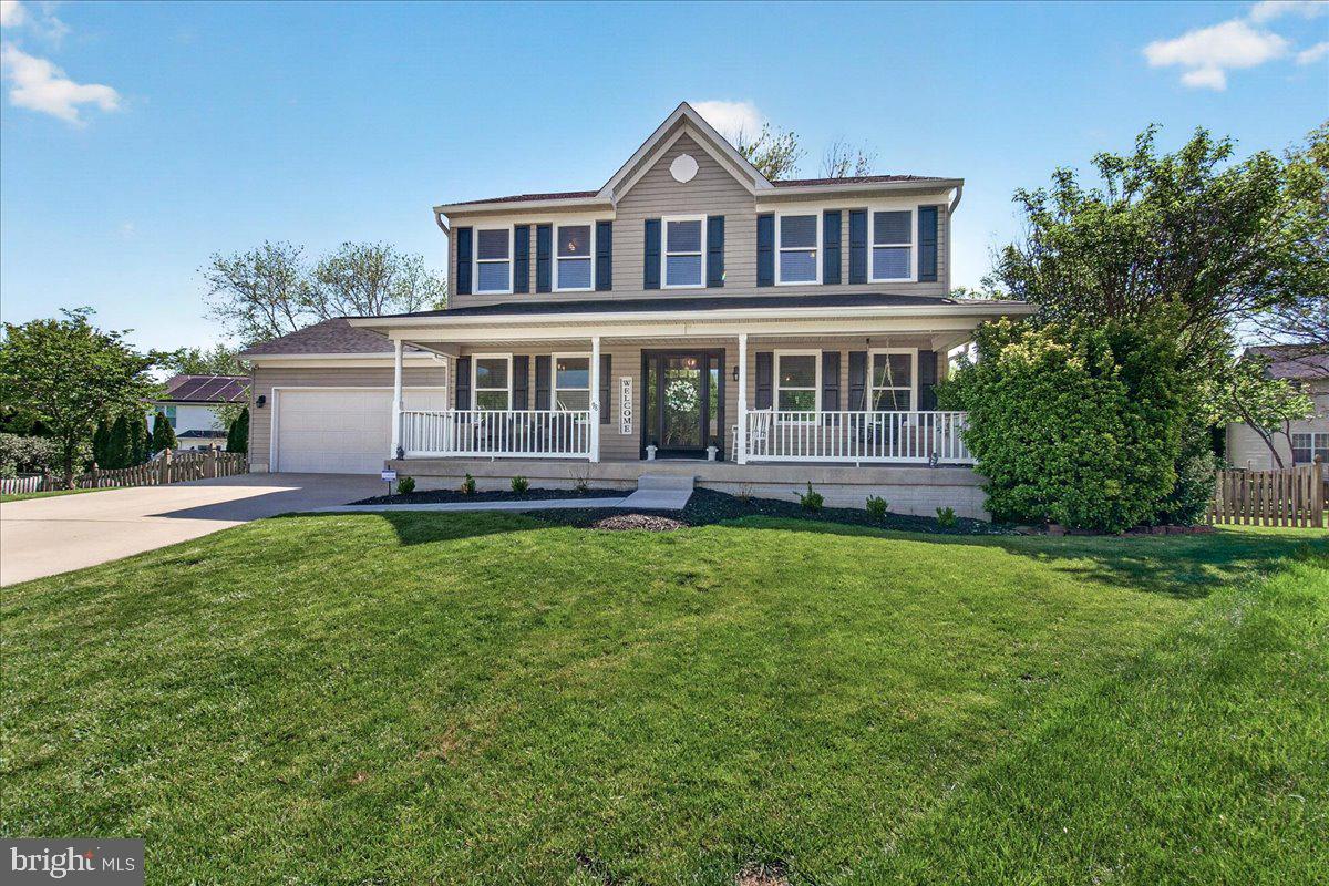 98 Pleasanton Court Frederick, MD 21702 - Photo 2 of 62 a front view of a house with a yard