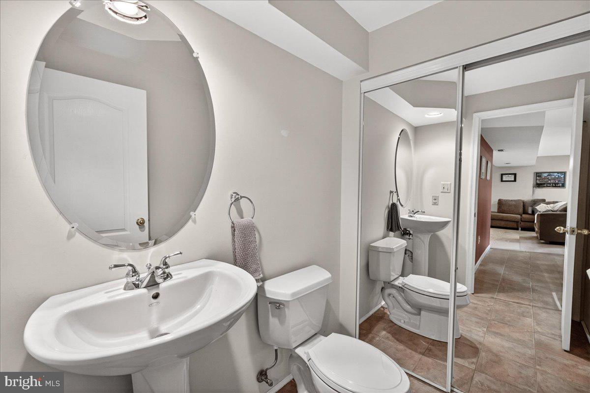 98 Pleasanton Court Frederick, MD 21702 - Photo 27 of 62 a bathroom with a toilet sink and mirror