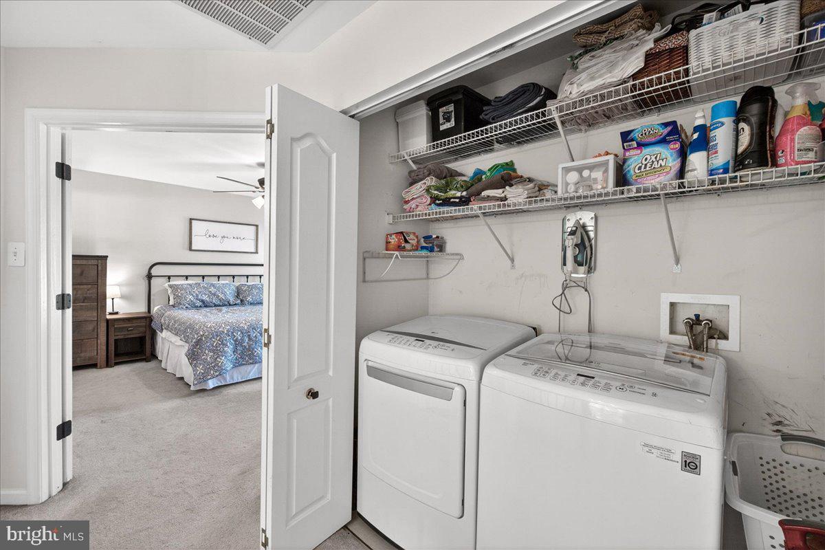 98 Pleasanton Court Frederick, MD 21702 - Photo 30 of 62 a view of storage and utility room with washer and dryer