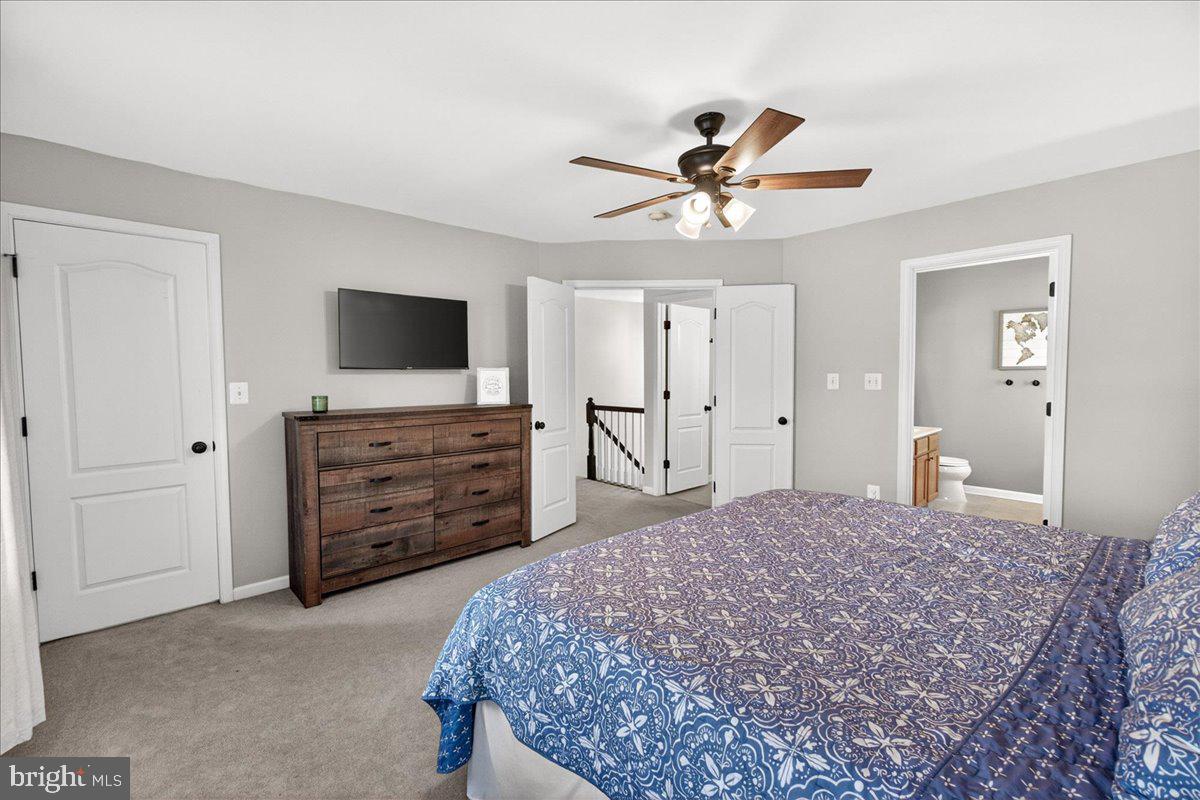 98 Pleasanton Court Frederick, MD 21702 - Photo 33 of 62 a bedroom with a bed and a flat screen television