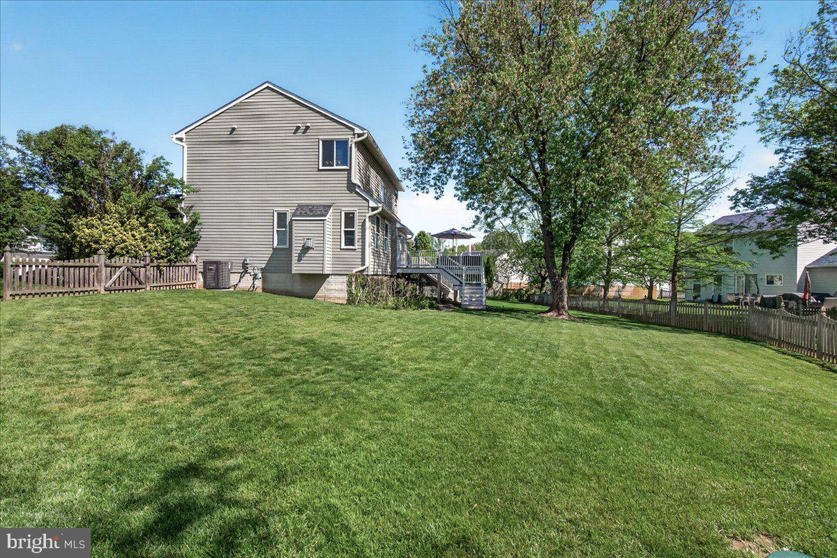 98 Pleasanton Court Frederick, MD 21702 - Photo 41 of 62 a front view of a house with a yard