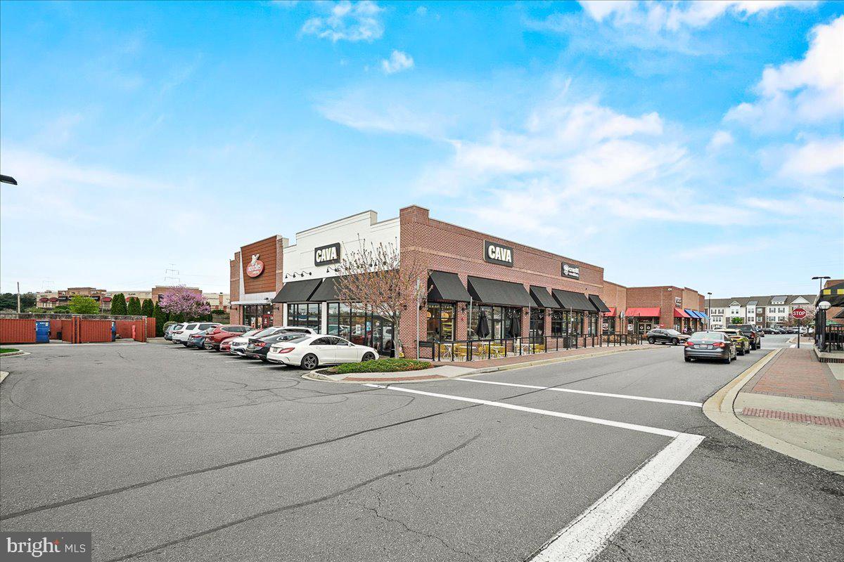 98 Pleasanton Court Frederick, MD 21702 - Photo 46 of 62 a city view with tall buildings and cars parked on road