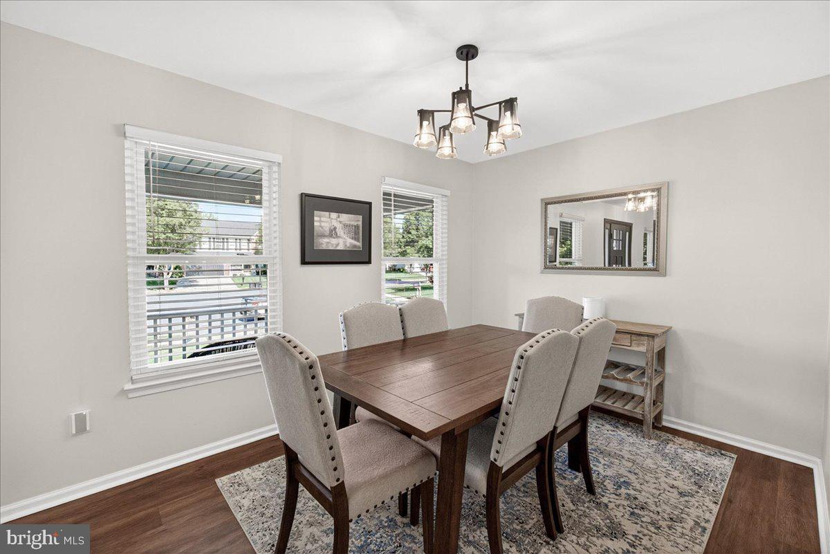 98 Pleasanton Court Frederick, MD 21702 - Photo 9 of 62 a view of a dining room with furniture window and wooden floor