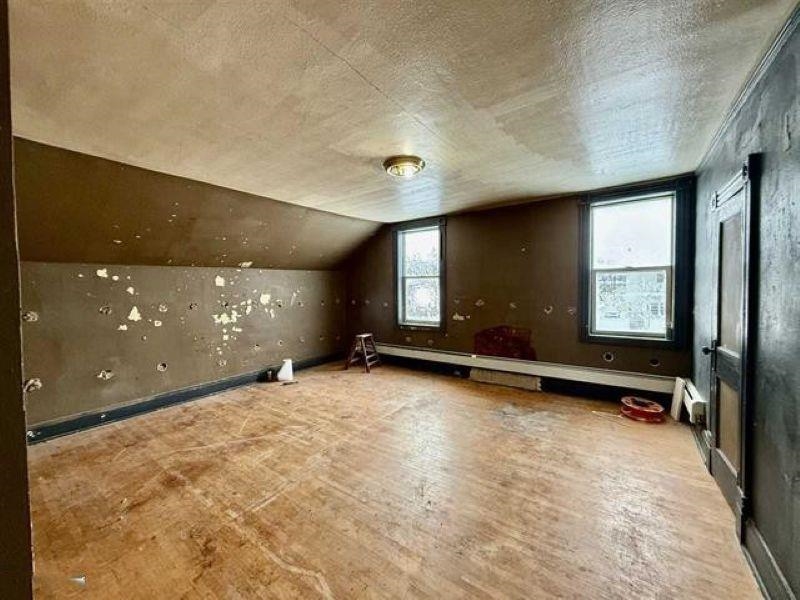 922 South 5th Avenue Virginia, MN 55792 - Photo 9 of 12 Bonus room with vaulted ceiling and a textured ceiling