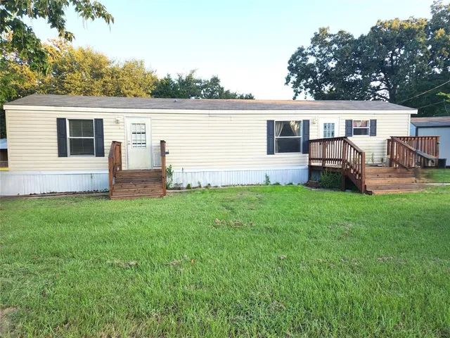 a front view of house with yard and seating area