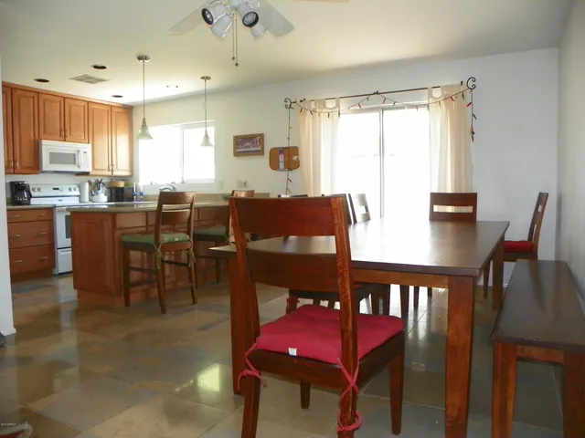 a view of a dining room with furniture