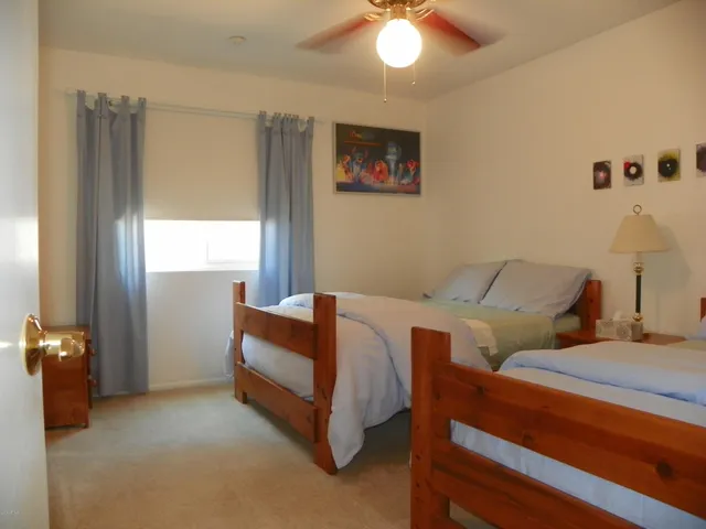 a bedroom with furniture and a chandelier