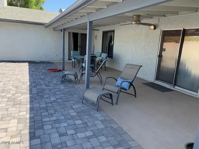 a view of a room with table and chairs