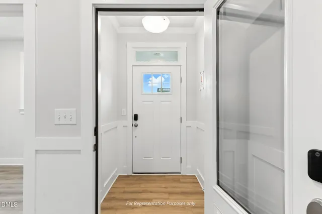 a view of a hallway with wooden door