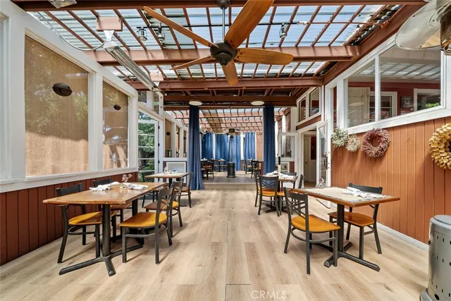 a view of backyard with sitting area