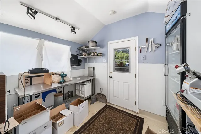 a bedroom with a bed a table and chair