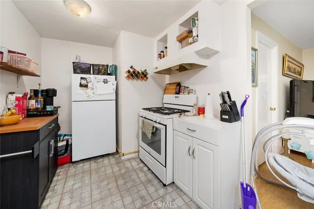 a kitchen with cabinets and appliances