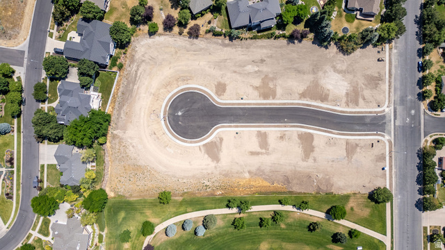 1473 Red Fox Court, Unit 4 Logan, UT 84321 - Photo 11 of 19 Expansive undeveloped parcel featuring a cul-de-sac and paved street infrastructure
