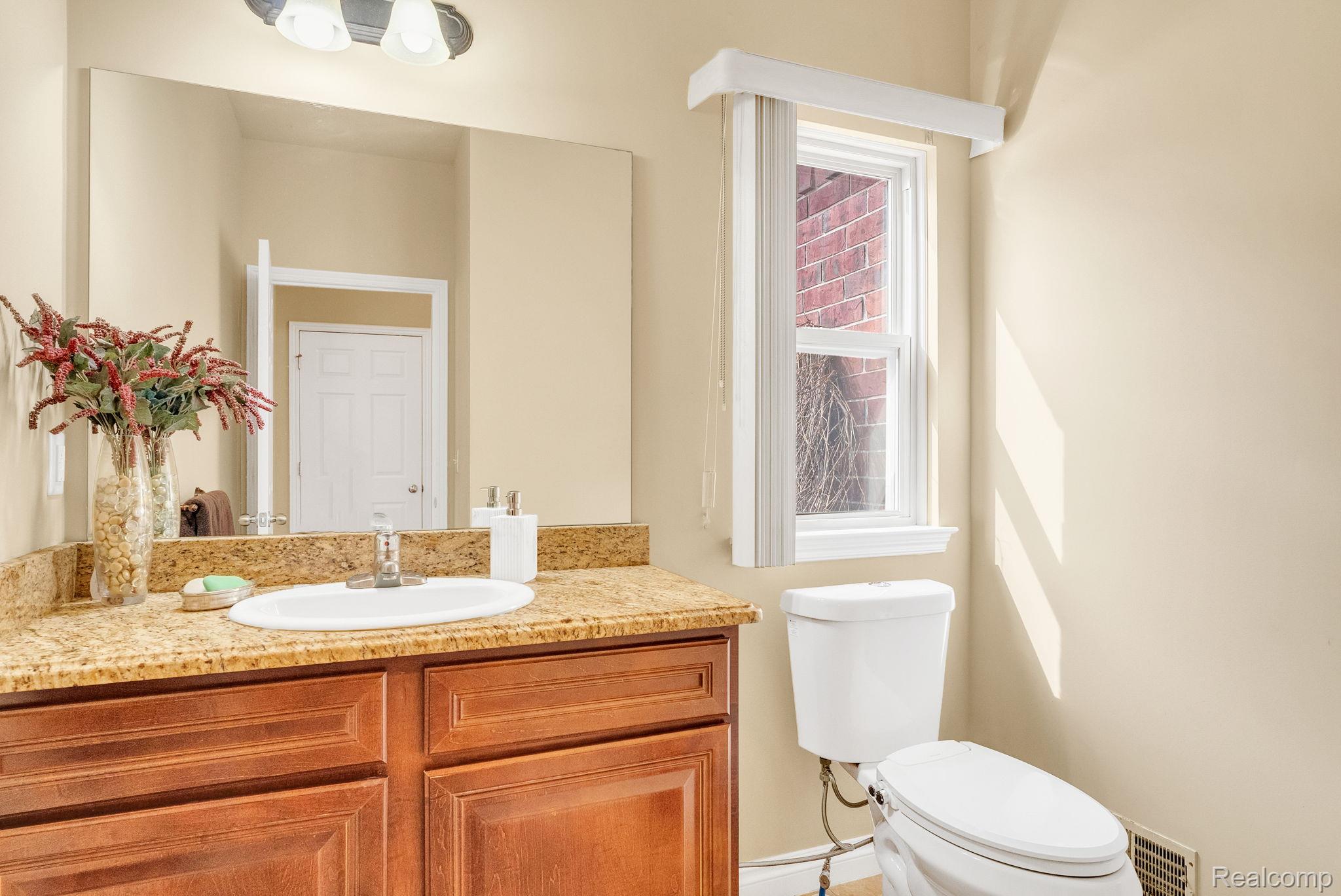 4122 Hawks Nest Road Utica, MI 48317 - Photo 35 of 74 Half bath with vanity and toilet