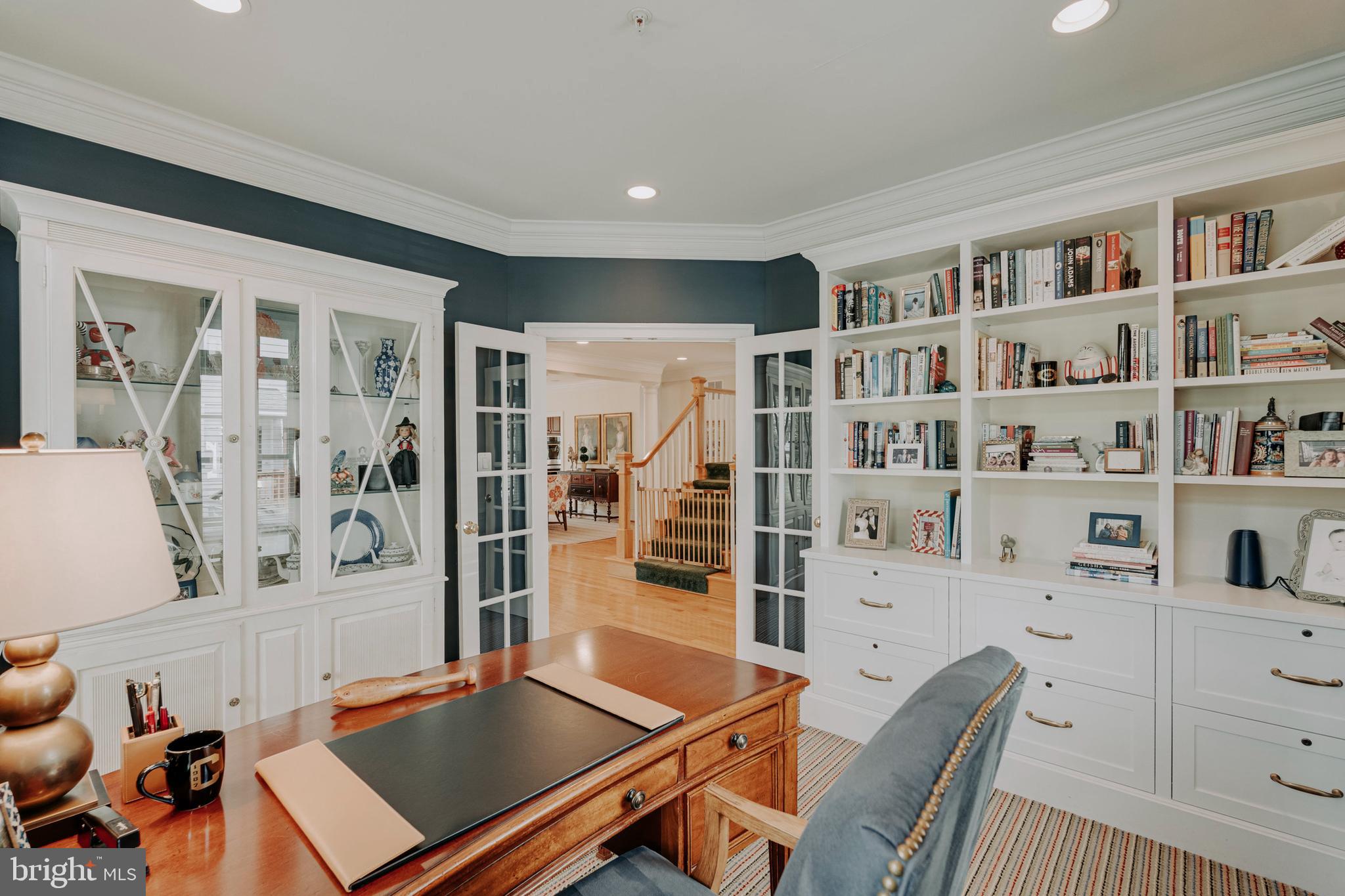 8502 Rayburn Road Bethesda, MD 20817 - Photo 18 of 49 a room with furniture a rug and a book shelf