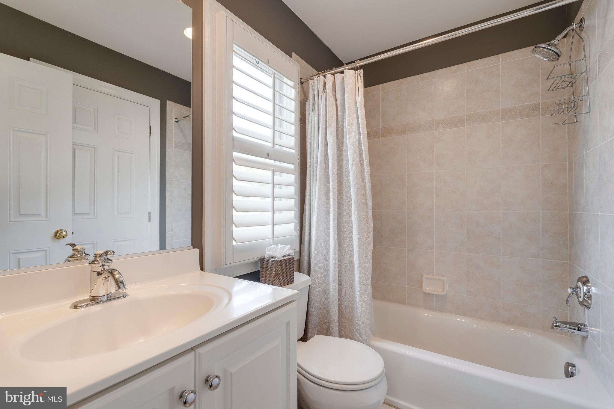 8502 Rayburn Road Bethesda, MD 20817 - Photo 29 of 49 a bathroom with a sink toilet and shower