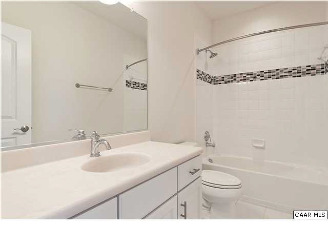 2128 Avinity Loop Charlottesville, VA 22902 - Photo 17 of 28 a bathroom with a sink vanity granite toilet tub and shower
