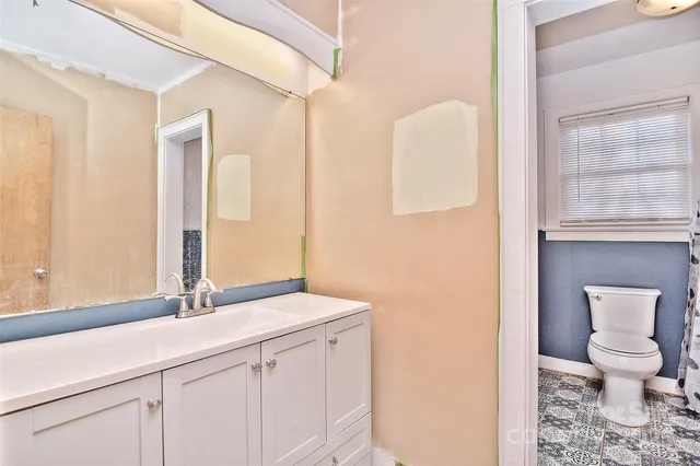 a view of a room with wooden floor and window