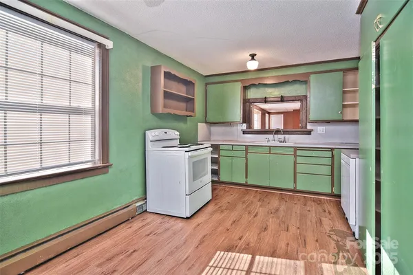 a room with washing machine and sink