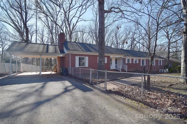 a kitchen with a stove a sink and cabinets