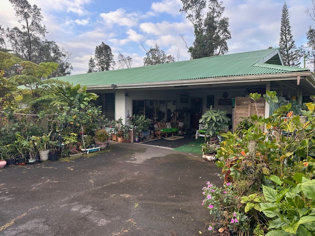 1379 Mele Manu Street Hilo, HI 96720 - Photo 1 of 20 a view of a patio with table and chairs and potted plants