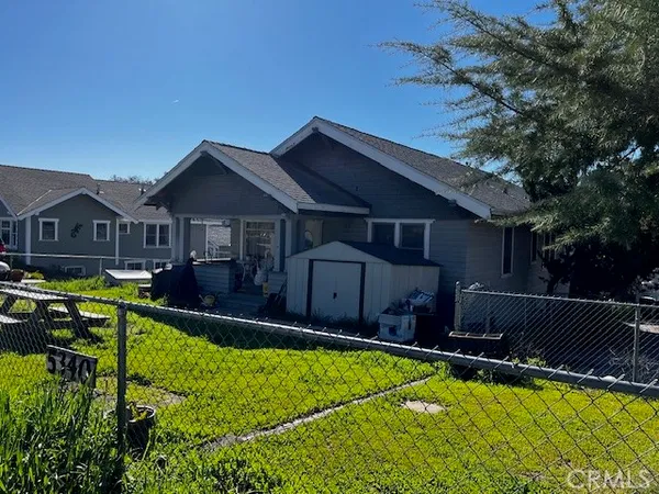 a view of a house with swimming pool yard and porch