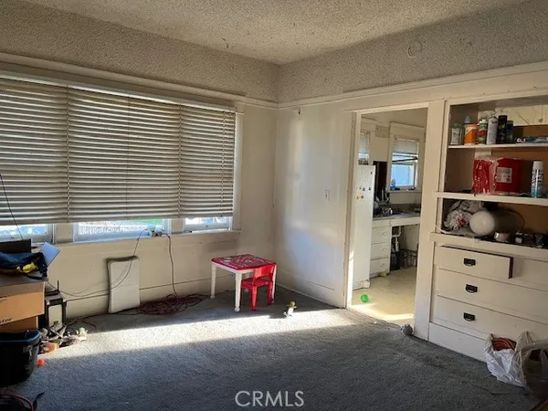 a view of workspace with furniture and window