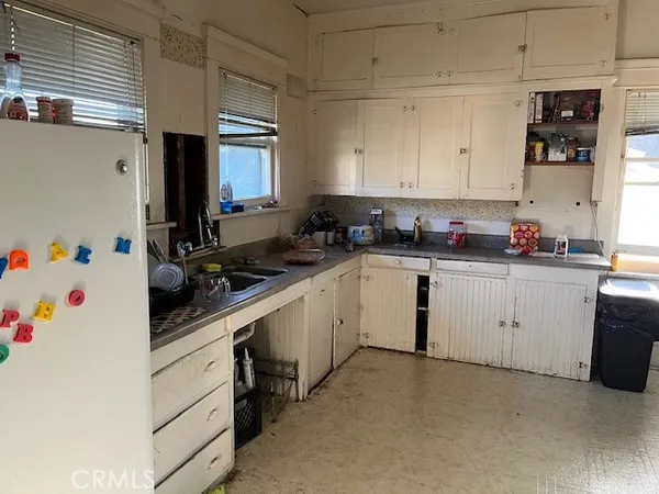 a room with furniture and flat screen tv