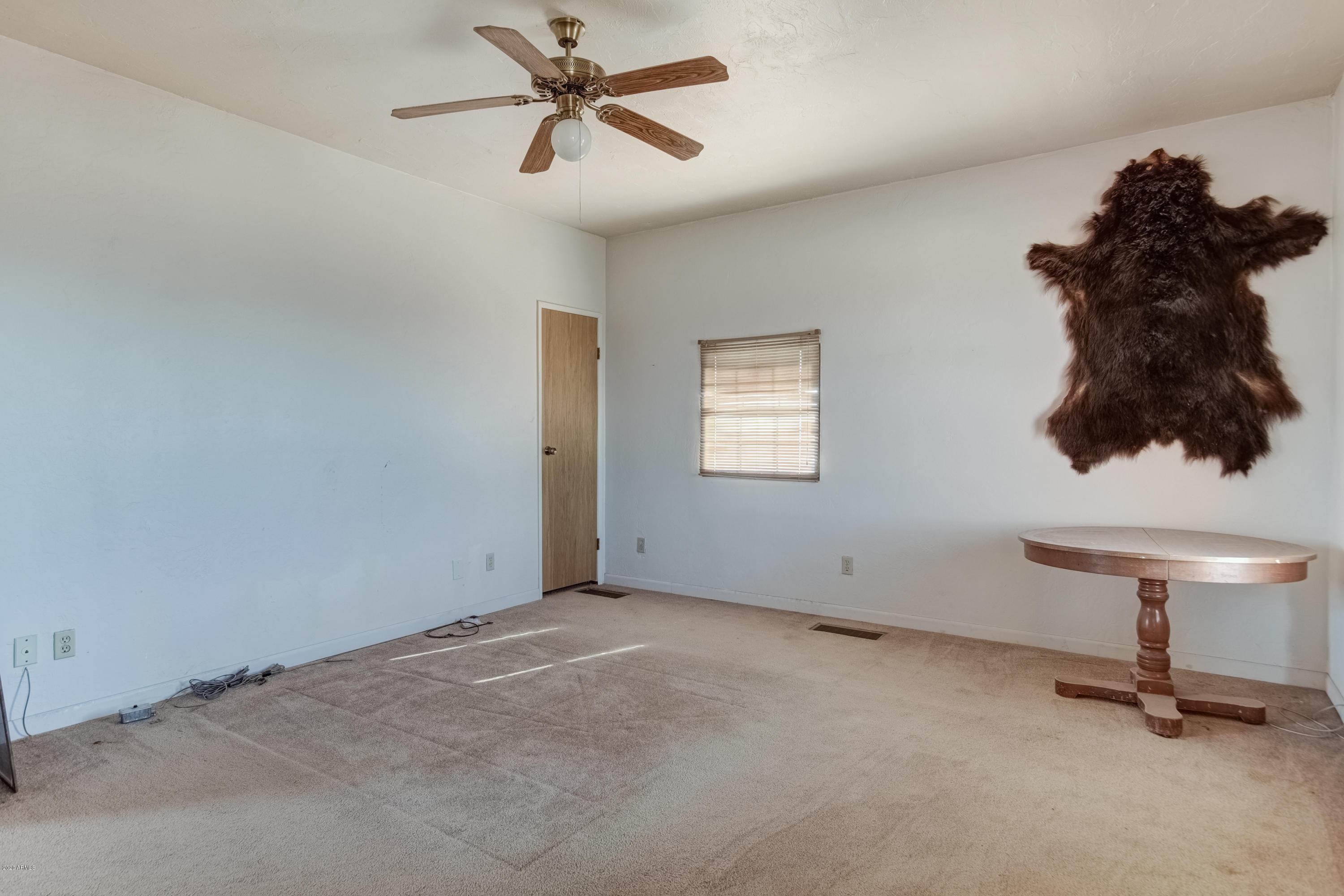 667 South Opal Road Maricopa, AZ 85139 - Photo 11 of 42 a view of empty room with windows