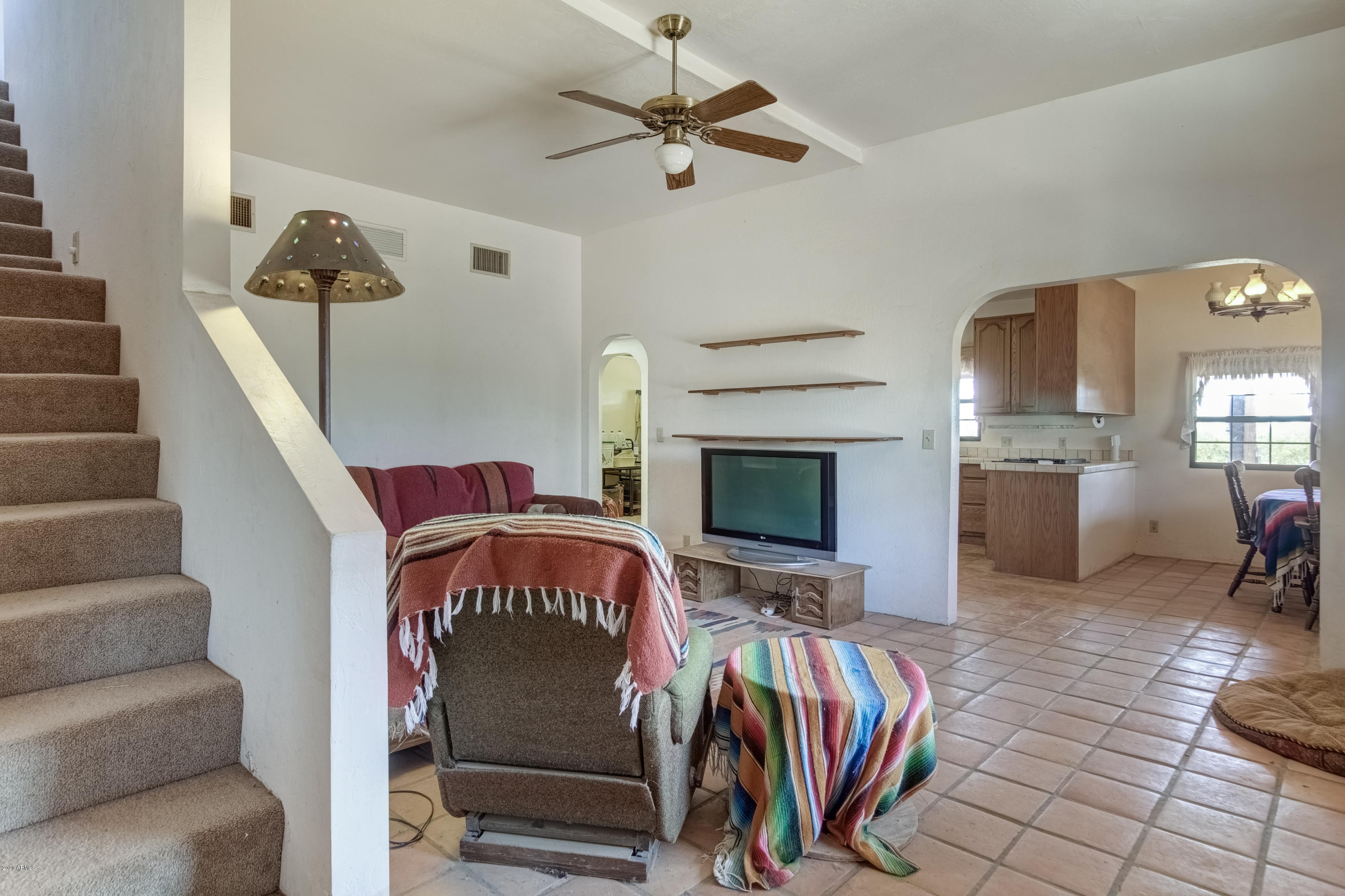 667 South Opal Road Maricopa, AZ 85139 - Photo 12 of 42 a view of a livingroom with furniture and a ceiling fan