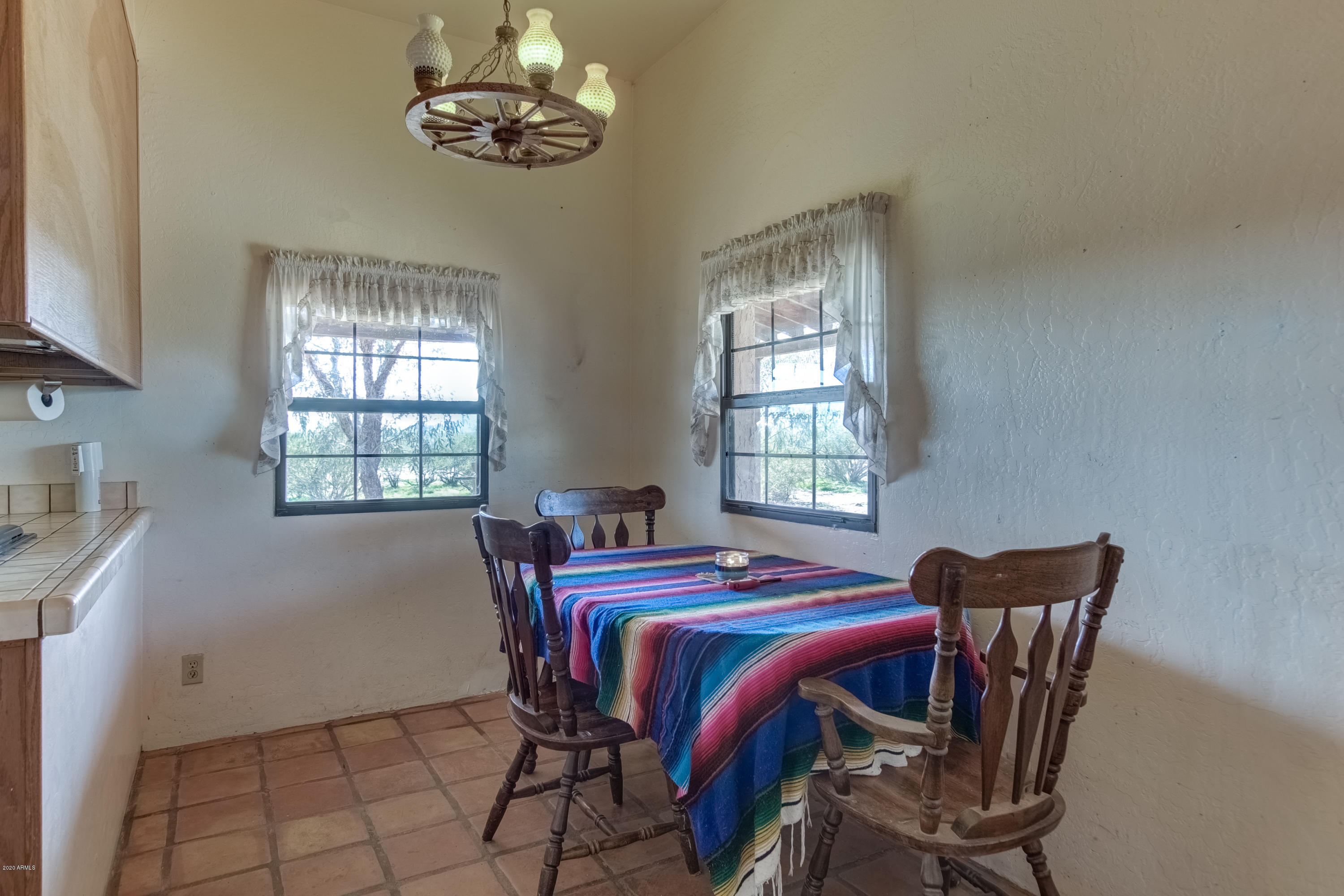 667 South Opal Road Maricopa, AZ 85139 - Photo 17 of 42 a bedroom with a bed and a table