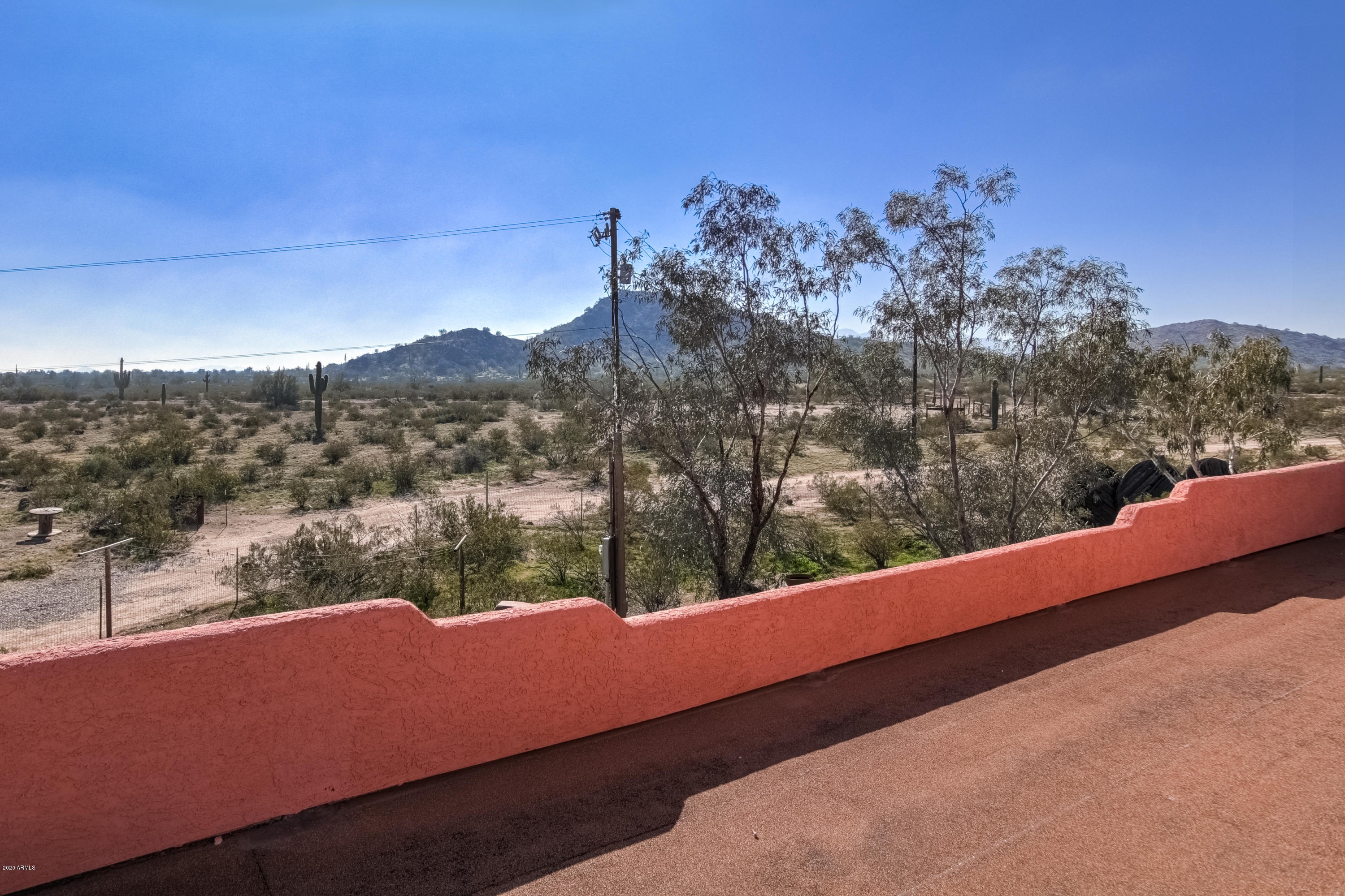 667 South Opal Road Maricopa, AZ 85139 - Photo 2 of 42 a view of a yard from a balcony