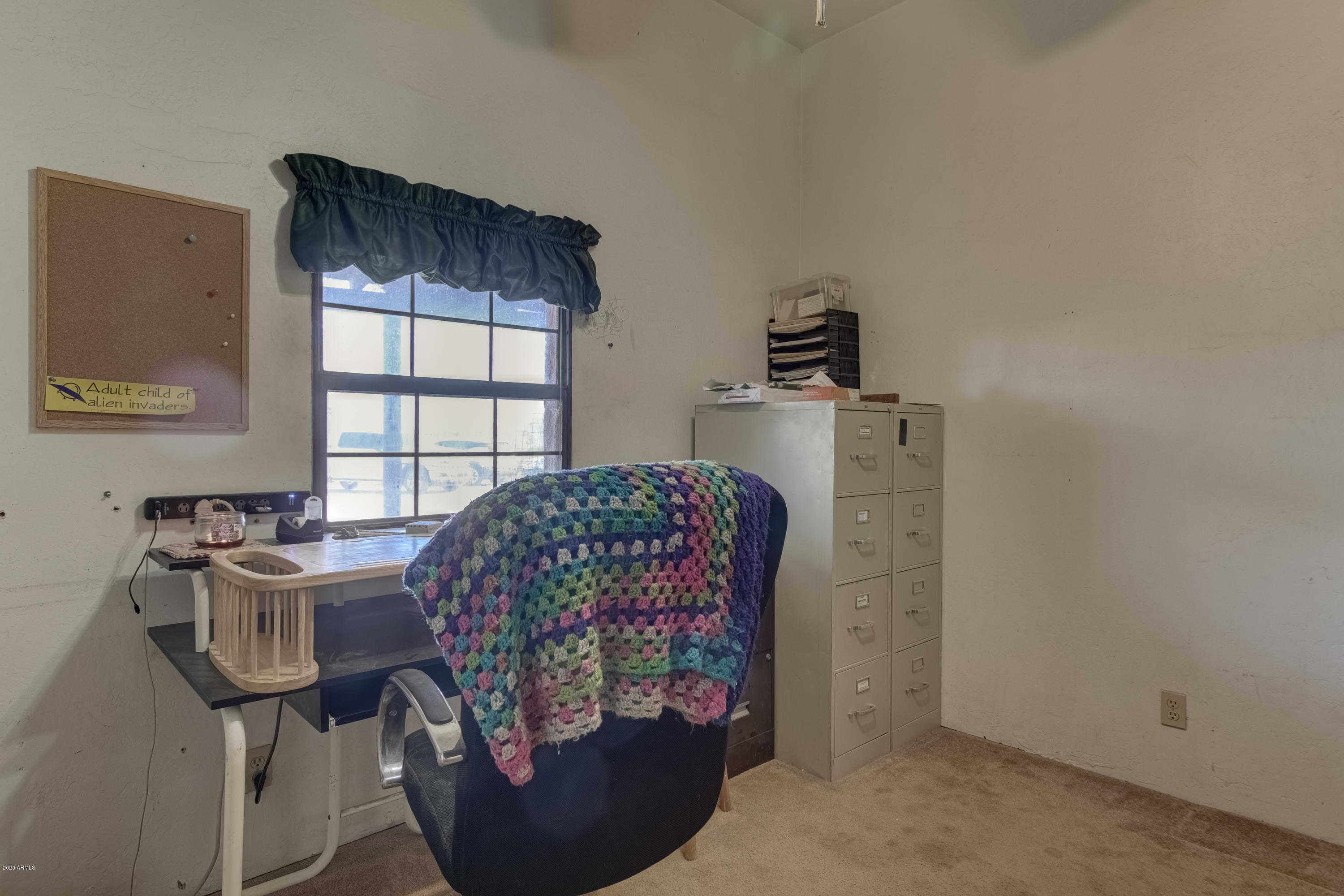 667 South Opal Road Maricopa, AZ 85139 - Photo 21 of 42 a living room with furniture and a window